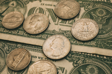 Close up view of American dollar bills and coins as background.  