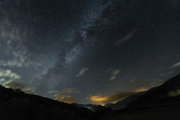 starry sky over the valley of a mountain landscape