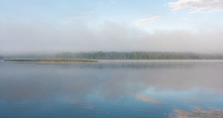Obraz na płótnie Canvas Fog on the lake. Pskov region, Russia