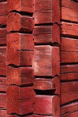 A corner of an old log shed in sunshine