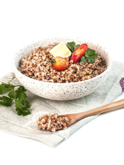 dietary buckwheat porridge with vegetables on a white background isolated