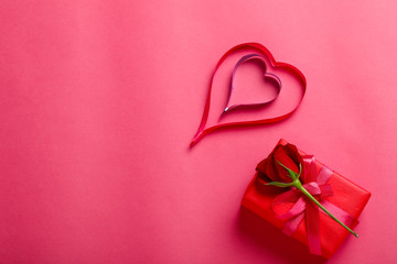 Little heart,red rose flower and gift box on pink background.Valentine day concept 