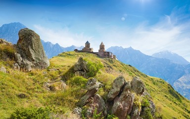Fototapeta na wymiar Gergeti Trinity Church near village Kazbegi in Georgia, Caucasus