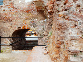 Old red arch brick wall building that was used as sugar factory