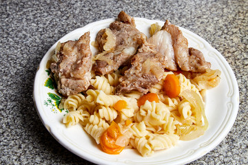 Cooking. Grilled meat on a plate with garnish and tomatoes
