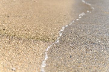 Fototapeta na wymiar water on the sandy sea beach