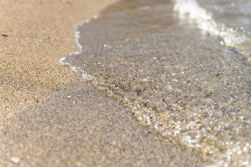 Fototapeta na wymiar water on the sandy sea beach