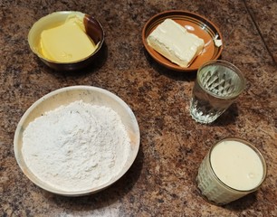 set of ingredients for cake on table