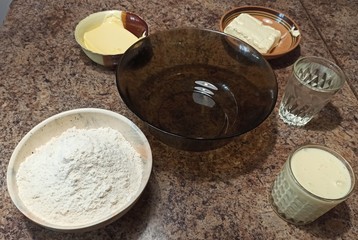 set of ingredients for cake on table