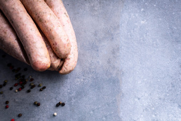 Fototapeta premium Traditional country homemade sausage on a stony background.