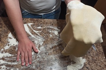 woman confectioner hold dough on hand