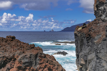 Fototapeta na wymiar La Frontera volcanic seascape, with Roques de Salmor horizon view, Atlantiv ocean, El Hierro, Canary islands, Spain