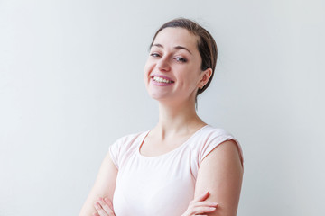 Happy girl smiling. Beauty portrait young happy positive laughing brunette woman on white background isolated. European woman. Positive human emotion facial expression body language