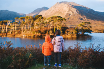 boy and girl looking at mountain