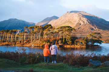 children enjoying view on lake
