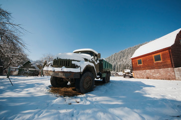 Truck covered with snow in the Ukrainian Carpathians