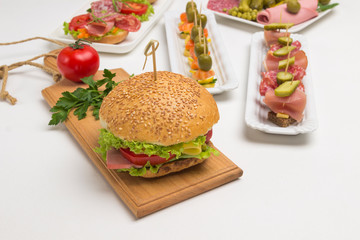 Breakfast buffet table with a variety of snacks on festival table outdoor. .