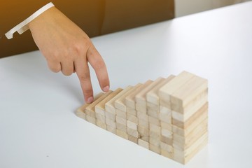 .Planning risk and strategy in businessman gambling placing wooden block.Business concept for...