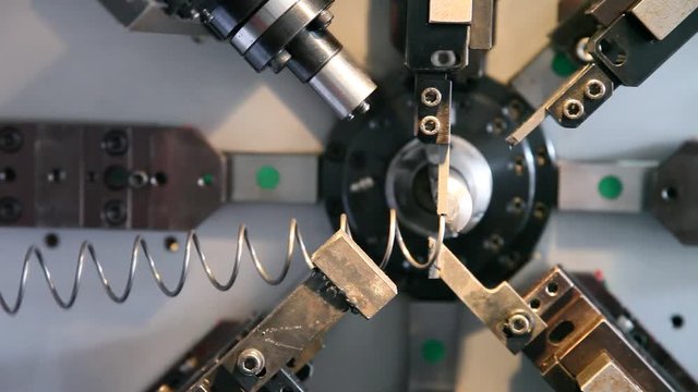  The coil spring manufacturing machine 
