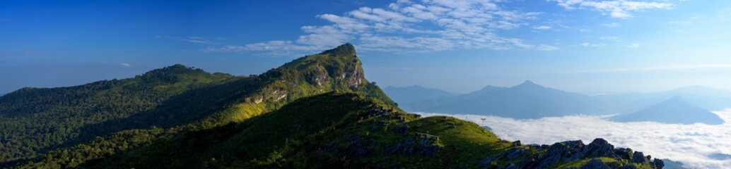 Fototapeta na wymiar Panoramic beautiful mountains and fog at Chiang rai, Thailand.