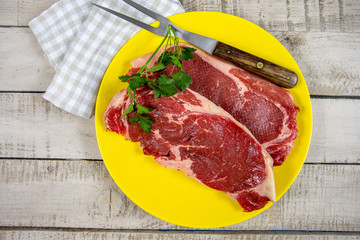 raw beef ribeye on a plate