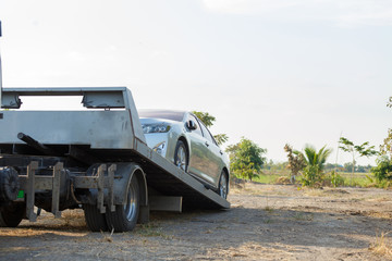 Tow car service on side for loading broken car to the garage.