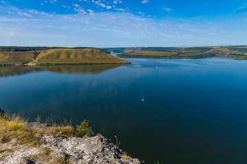 top view summer time landscape of lake calm waters and hill land nature reservation
