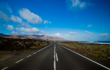 Black road in volcanic land