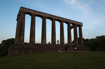 National Monument of Scotland in silhouette on Calton Hill, Edinburgh, Scotland