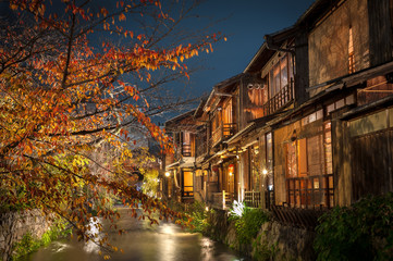 A stream runs past old wooden houses on Shirakawa Dori in the Gion district of Kyoto, Japan