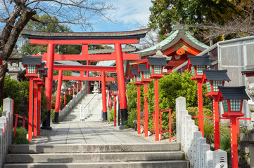 Traditional red torii gates leading to Sankou Inari Shrine at Inuyama Castle, Aichi Prefecture, Japan.