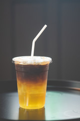 Glass of espresso shot mixed with sparkling soda and orange juice