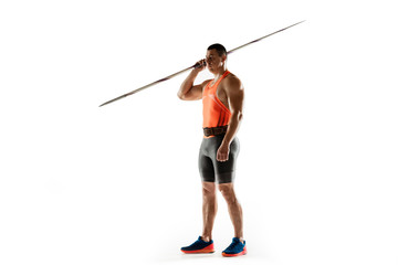 Male athlete practicing in throwing javelin isolated on white background. Professional sportsman, thrower posing confident. Concept of healthy lifestyle, movement, activity, competition. Copyspace.