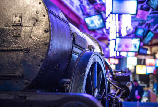 time machine travel past future meet old new train locomotive screen museum technology blue neon
