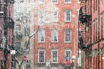 Blowing snow covers the buildings on Waverly Place in the Greenwich Village neighborhood of New...