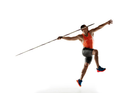 Male athlete practicing in throwing javelin isolated on white studio background. Professional sportsman training in motion, action. Concept of healthy lifestyle, movement, activity. Copyspace.