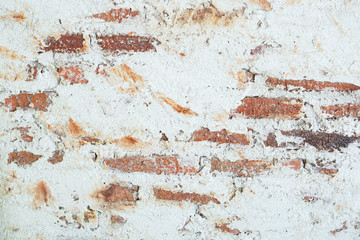 beautiful grunge plater strucco wall with  orange brick  background 
