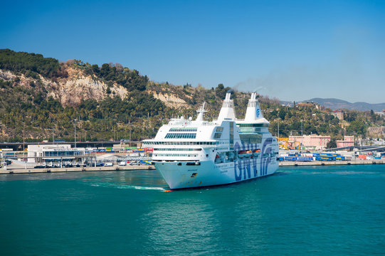 Barcelona, Spain - March 30, 2016: ocean liner GNV Rhapsody Genova in sea harbor at mountains. Cruise destination and liner trip. Summer vacation on liner. travelling discovery by sea liner