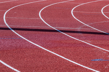 Fototapeta premium Red running sport track background and texture. Sport running track concept.