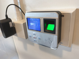 Fototapeta premium Finger print scan for unlock door security system. Record working time