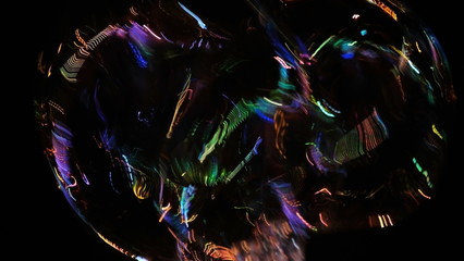  Soap bubble in the night city. Reflection of light on a soapy surface