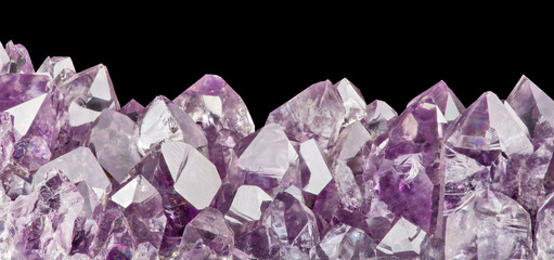 light amethyst crystals macro isolated on black