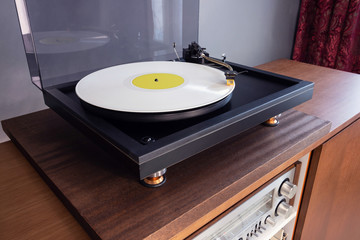 Vintage Stereo Turntable Plays White Vinyl Record Album