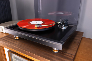 Vintage Stereo Turntable Plays Red Vinyl Record Album