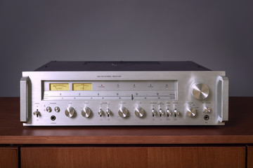 Vintage Stereo Receiver Standing on the Wooden Sideboard, Frontal View