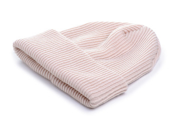 Beige knitted hat. Woolen winter hat on a white background isolation