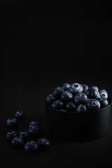 blueberries on black background