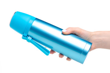 Blue metal thermos in hand on white background isolation