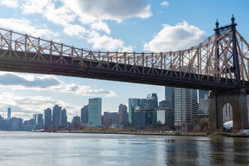 Fototapeta na wymiar Queensboro Bridge along the East River with the Midtown Manhattan Skyline in New York City