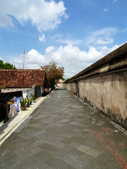 Fototapeta na wymiar Footpath made of natural gray stone in the Taman Sari area, Yogyakarta
